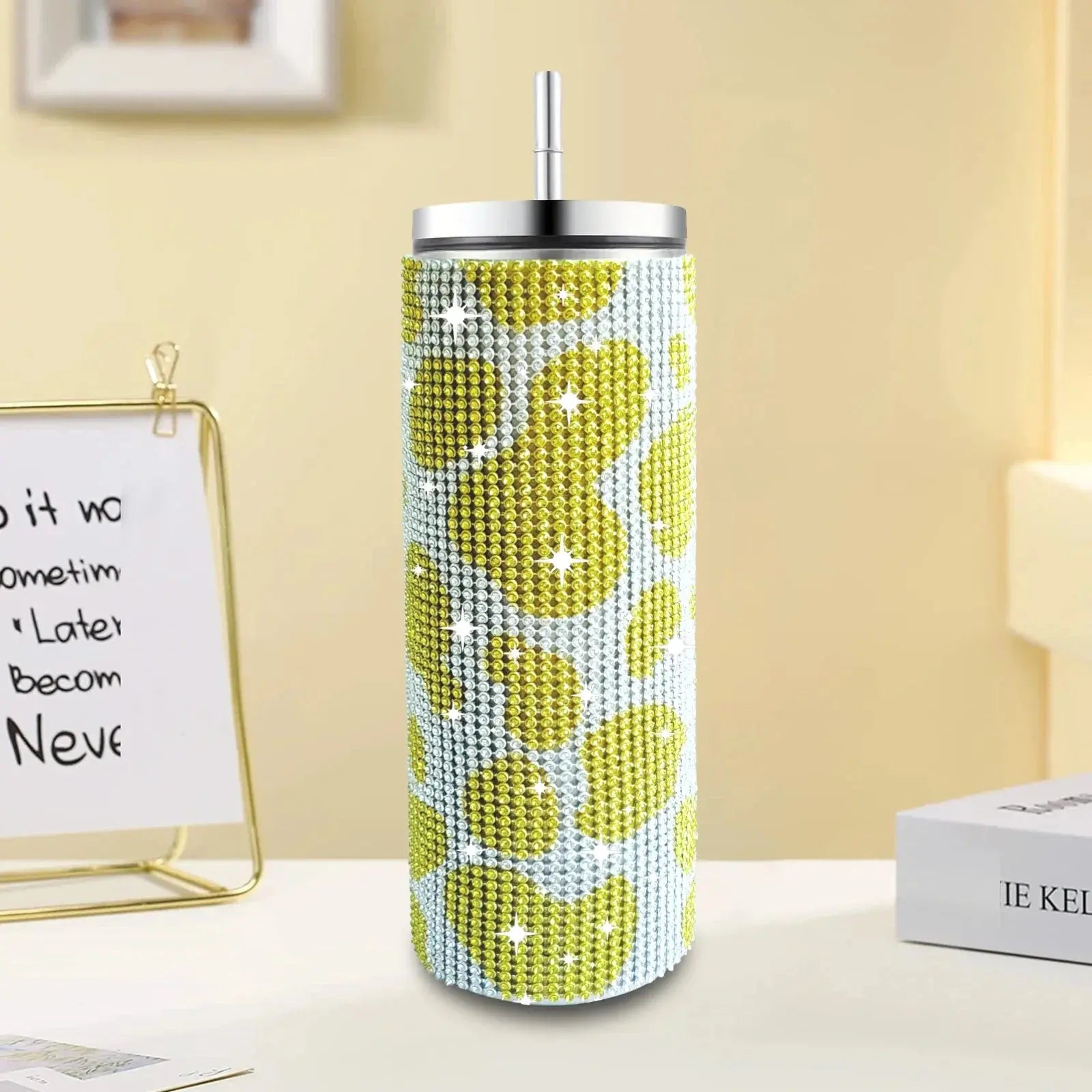 Tumbler with lemon pattern on a desk with a whiteboard in the background