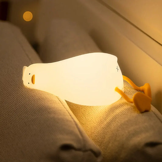White night light with yellow accents on a textured surface