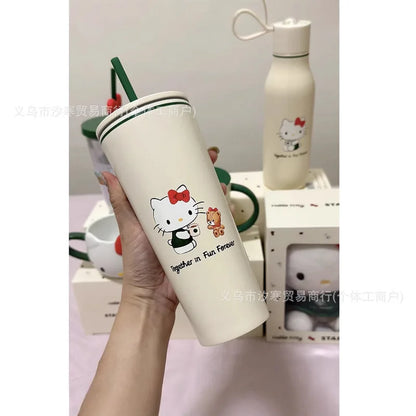 White tumbler with cartoon character design held by a hand, with another tumbler in the background.