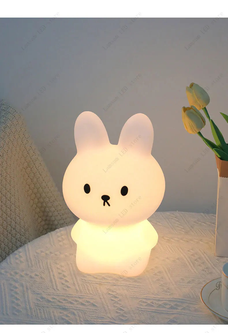 Cute rabbit-shaped night light on a surface with a soft background