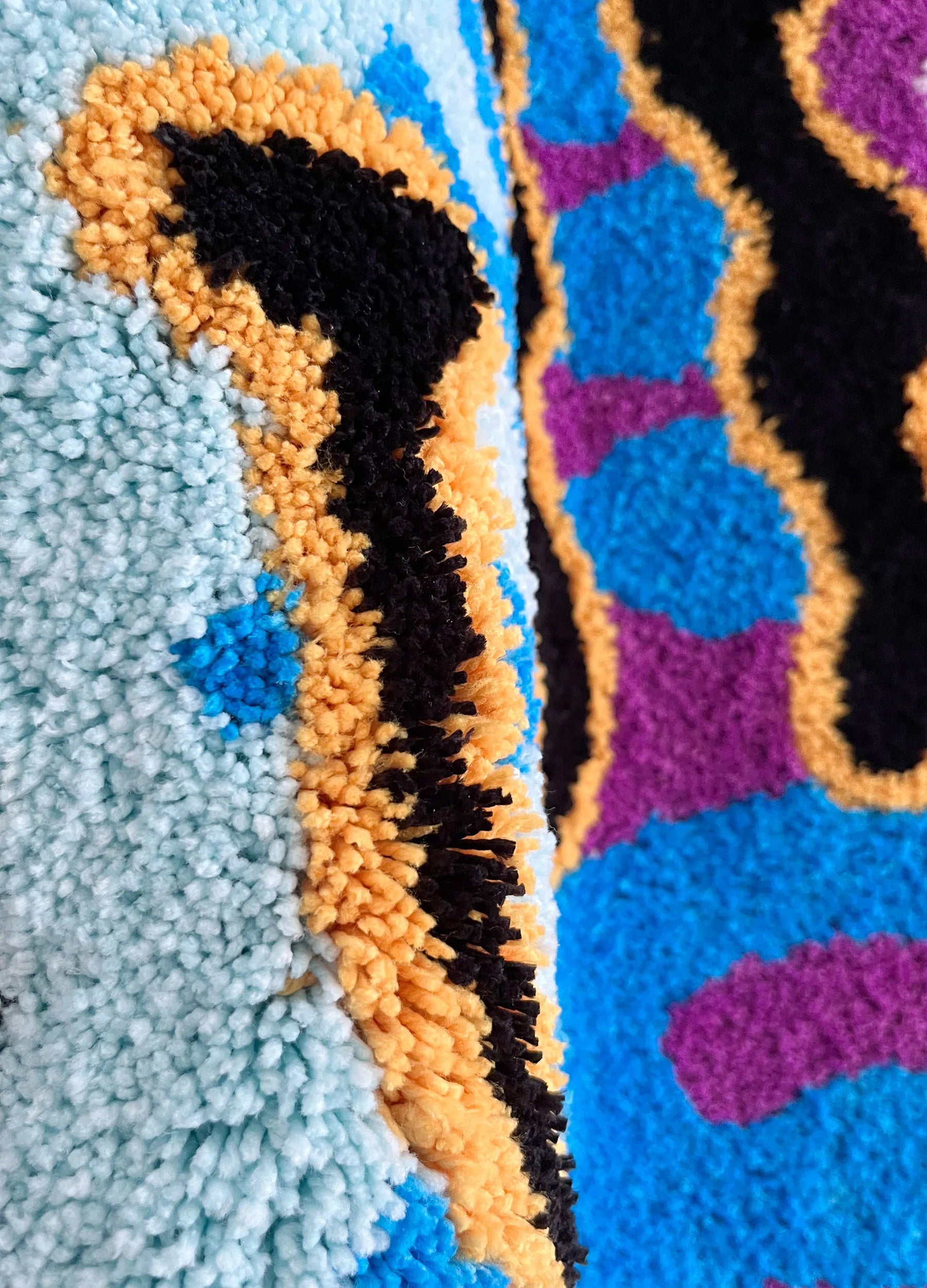 Close-up of textured fabric with colorful patterns
