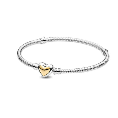Bracelet with a heart-shaped charm on a white background
