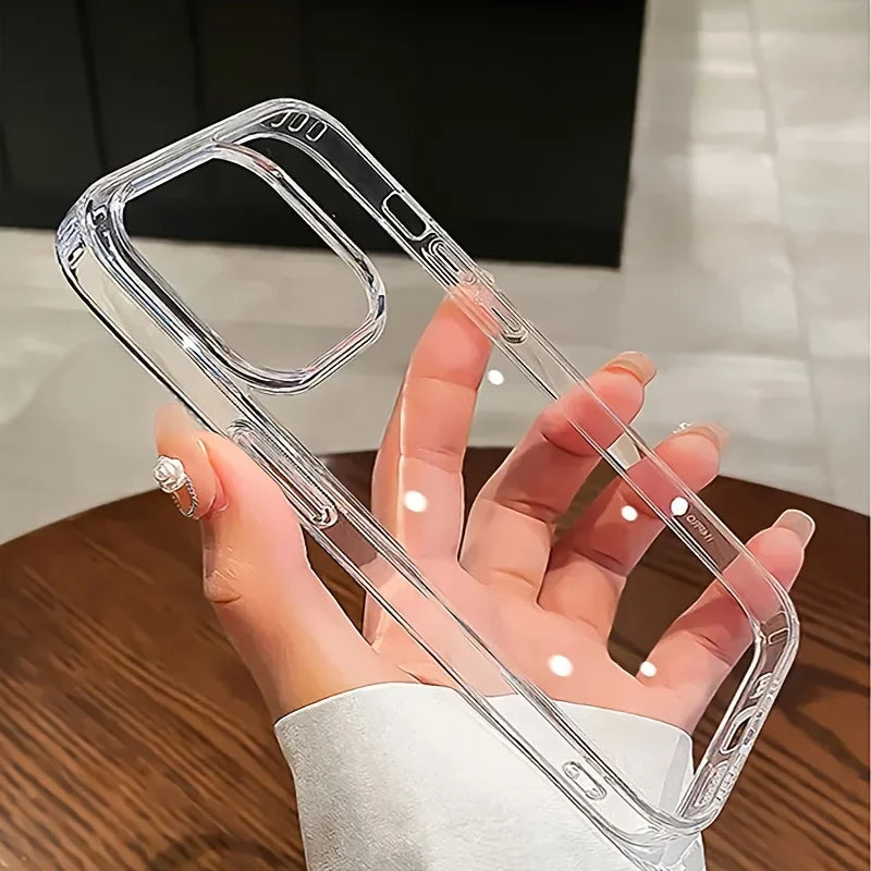 Clear phone case held by a hand on a wooden surface