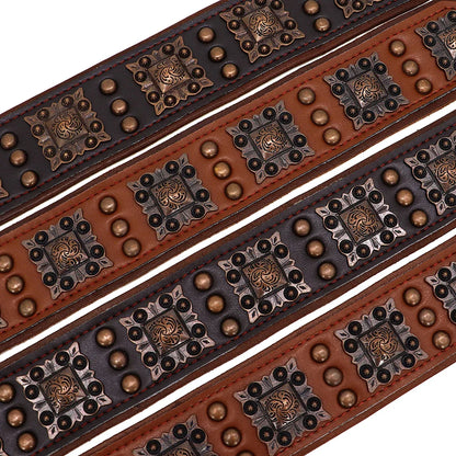 Decorative leather belts with metal studs and patterns on a white background