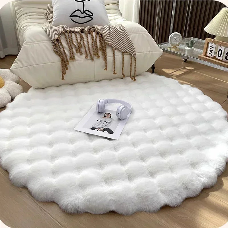 White fluffy rug on a wooden floor with a pillow and magazine in the background