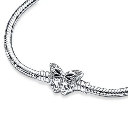 Silver bracelet with a butterfly charm on a white background