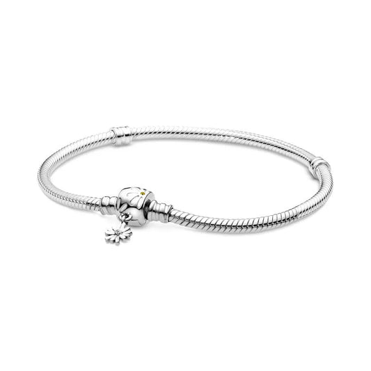 Silver bracelet with a flower charm on a white background