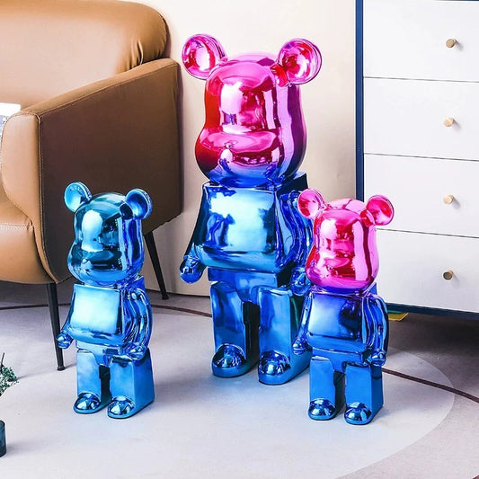 Colorful bear-shaped sculptures in a room with a beige armchair and white dresser. bearbrick collectable