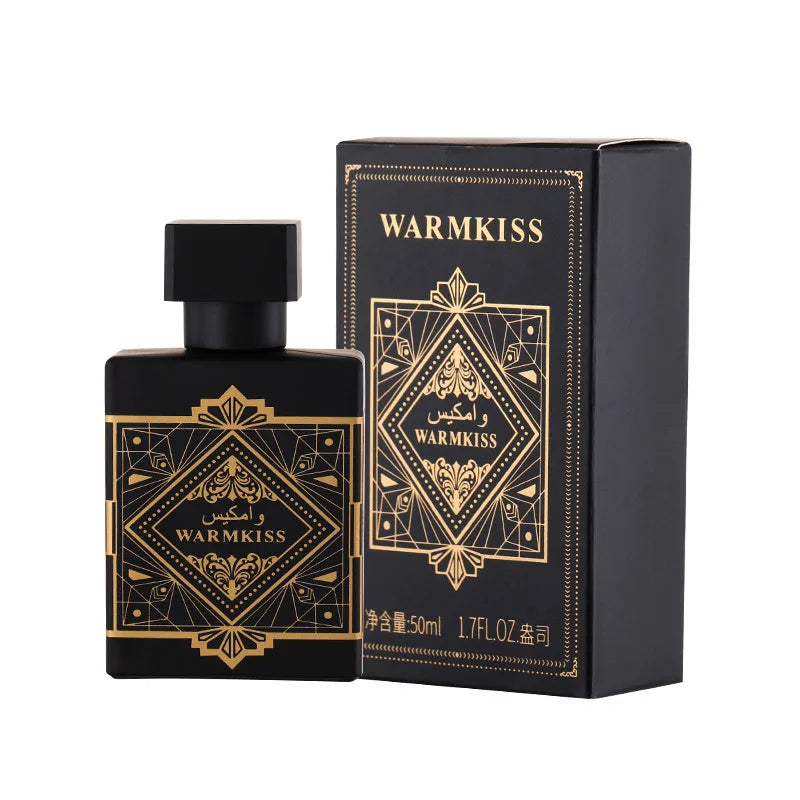 Black and gold perfume bottle and packaging with 'WARMKISS' branding on a white background