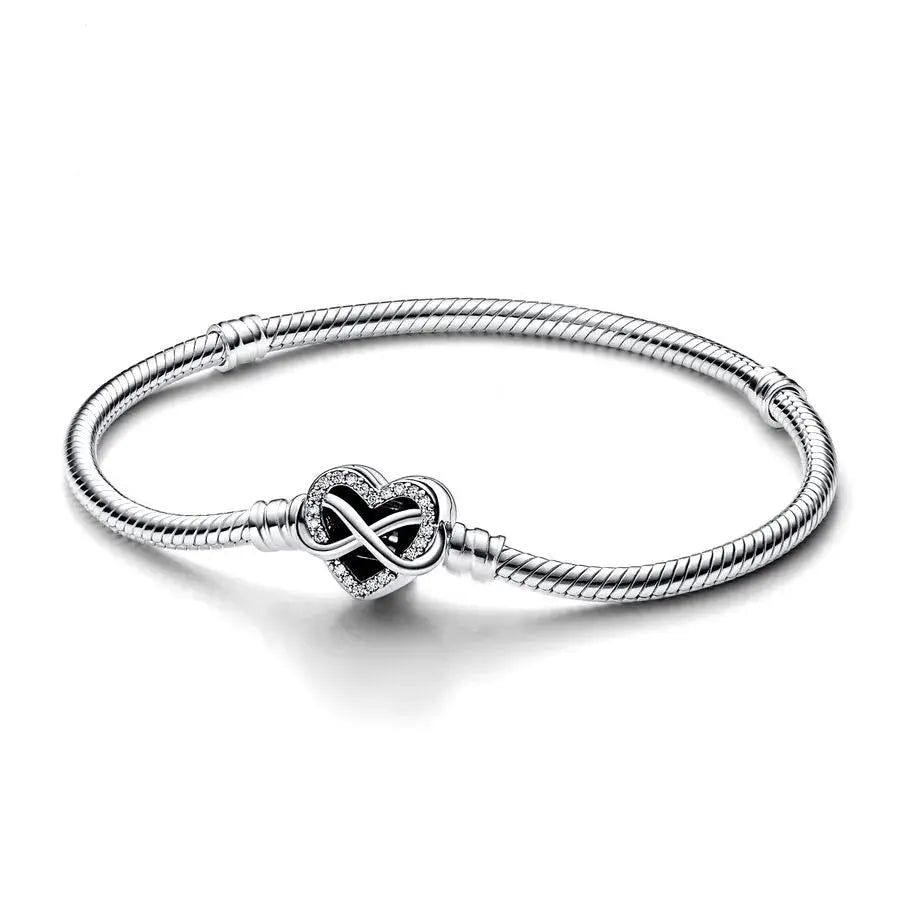 Silver bracelet with a heart-shaped clasp on a white background