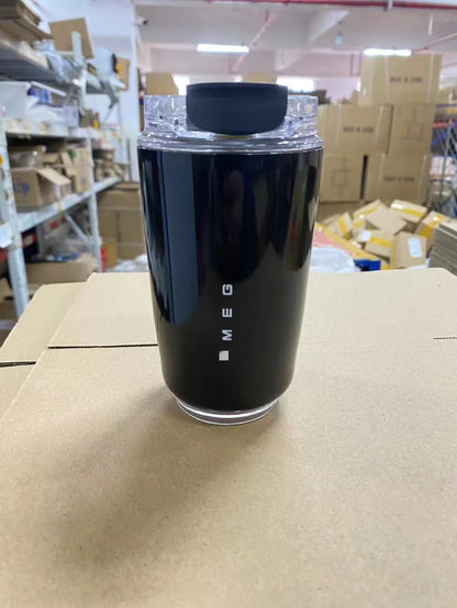 SMEG Black container with 'SMEG' branding on a cardboard surface in a warehouse setting