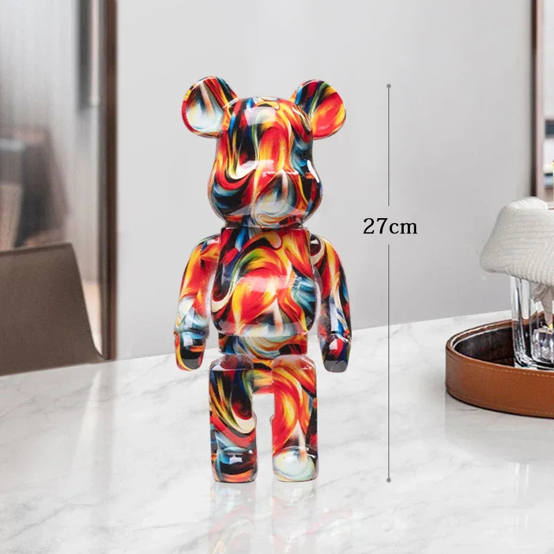 Colorful bear-shaped figurine on a white surface with a measurement label indicating its height. be@rbrick collectable