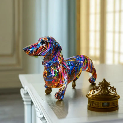 Colorful dog-shaped object on a white surface with a blurred background dashhound