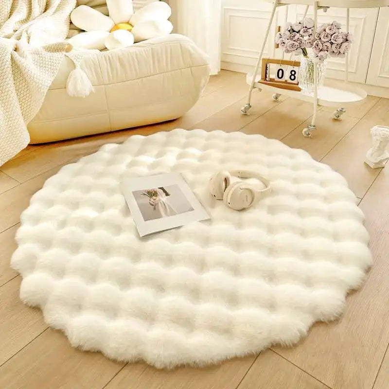 Round white fluffy rug on a wooden floor with a cozy living room setting.