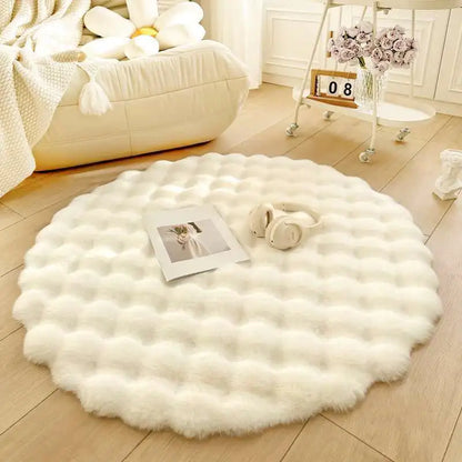 Round white fluffy rug on a wooden floor with a cozy living room setting.