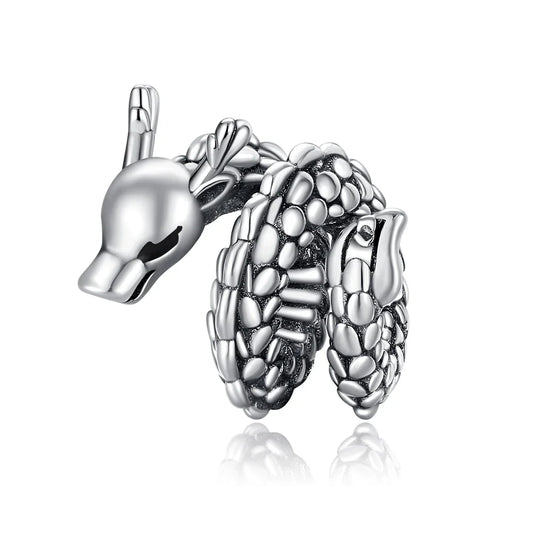 Silver hedgehog charm on a white background