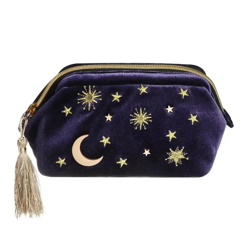 Navy blue pouch with gold stars and moon design on a white background