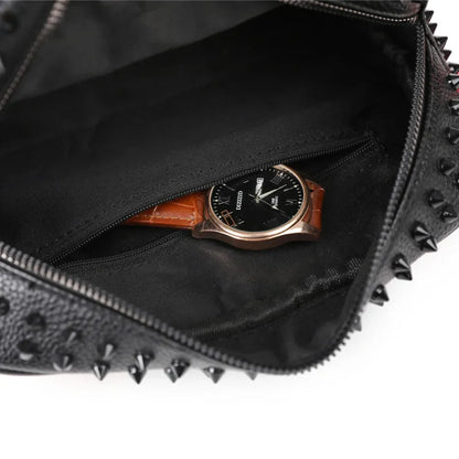 Black studded bag with a watch inside on a white background