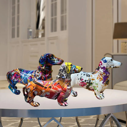 Three colorful dachshund figurines on a table with a blurred indoor background dashhound 