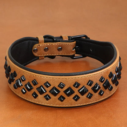 Dog collar with black studs on a brown background