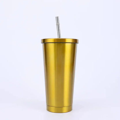 Gold metallic tumbler with a straw on a white background