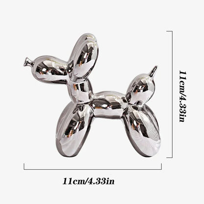 Silver balloon dog sculpture with dimensions on a white background
