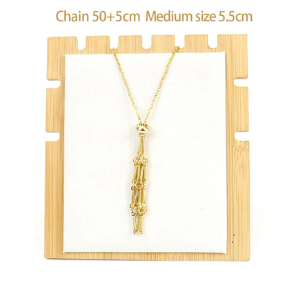 Gold necklace on a wooden display stand with measurements indicated.