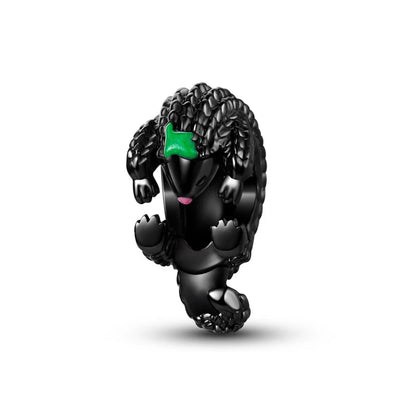 Black heghog figurine with a green bow on a white background heghog charm pendant. pandora style charm pendant. Gothic style, halloween theme 