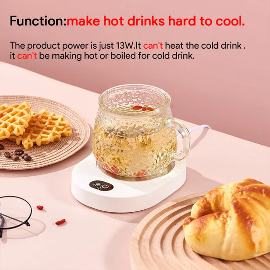 Thermostatic cup warmer keeping tea warm on a desk with pastries, highlighting 13W power and drink warming function.