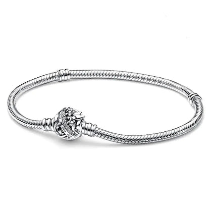 Silver bracelet with a decorative clasp on a white background