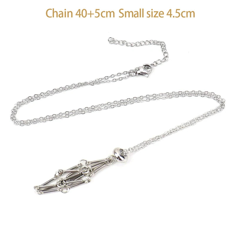 Silver necklace with a small pendant on a white background