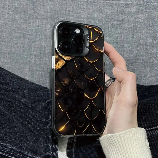 Phone case with dragon scale design held by a person against a gray background