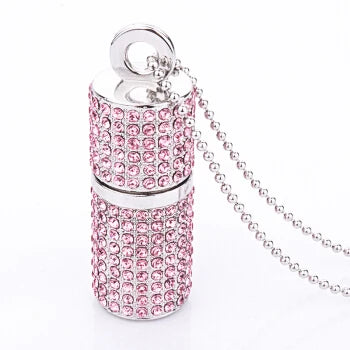 Pink lip balm-shaped keychain with rhinestones on a white background