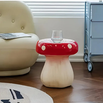 Mushroom-shaped side table with a red cap and white stem in a room setting.