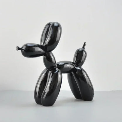 Black balloon dog sculpture on a white background