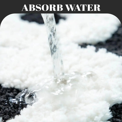 White absorbent material absorbing water from a spill.