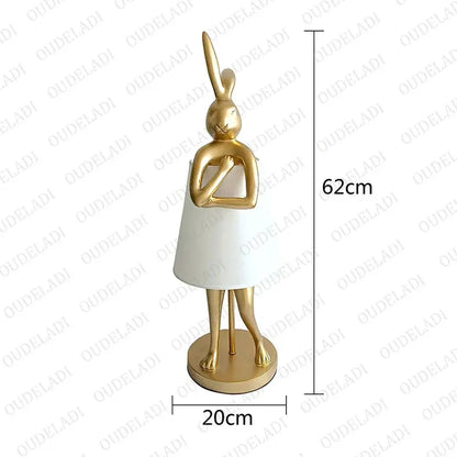 Gold and white decorative statue with dimensions on a white background