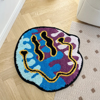 Colorful round rug with abstract design on a wooden floor