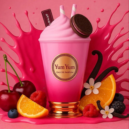 Pink 'Yum Yum' parfum bottle with vanilla bean, cherry, orange, and raspberry on a pink background