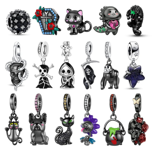 Collection of various black and silver charms on a white pandora style charm pendant background