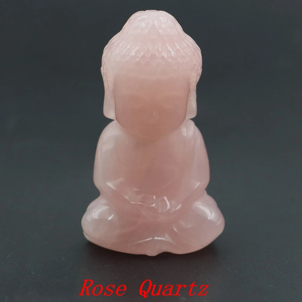 Rose Quartz Buddha figurine on a dark background