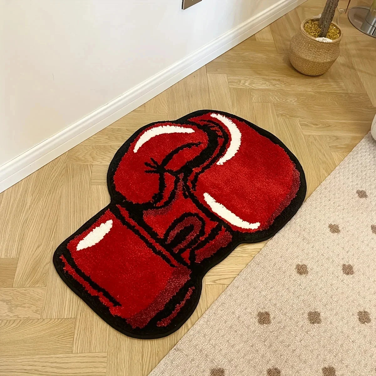 Red boxing glove rug on a wooden floor
