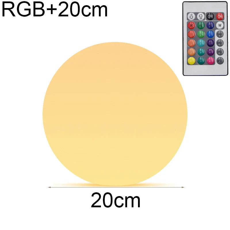 Round LED light with RGB+20cm text and remote control on a white background