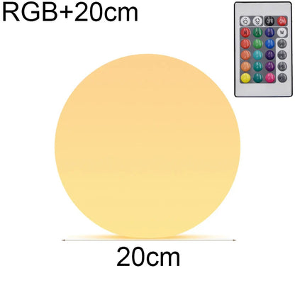 Round LED light with RGB+20cm text and remote control on a white background