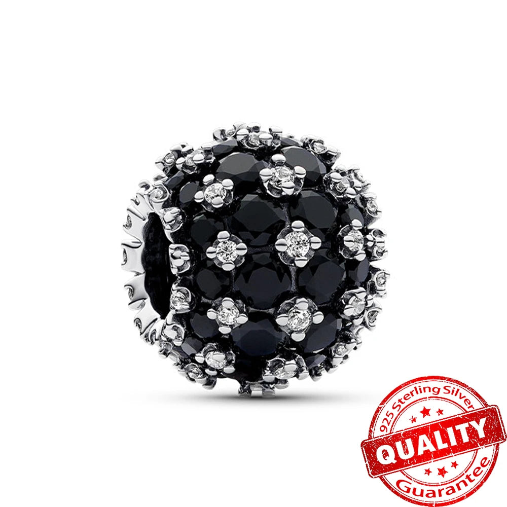 Jewellery charm with black stones and silver accents on a white background, featuring a '925 Sterling Silver' stamp. pandora style charm pendant. Gothic