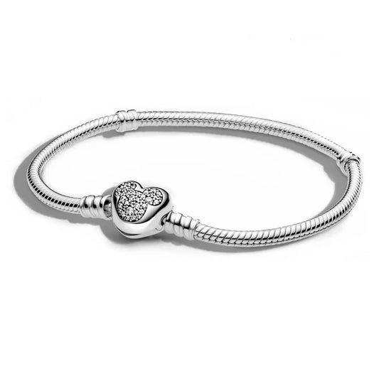 Disney Silver bracelet with a heart-shaped charm on a white background