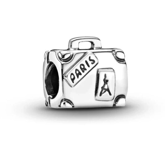 Silver charm shaped like a suitcase with 'Paris' and Eiffel Tower design on a white background