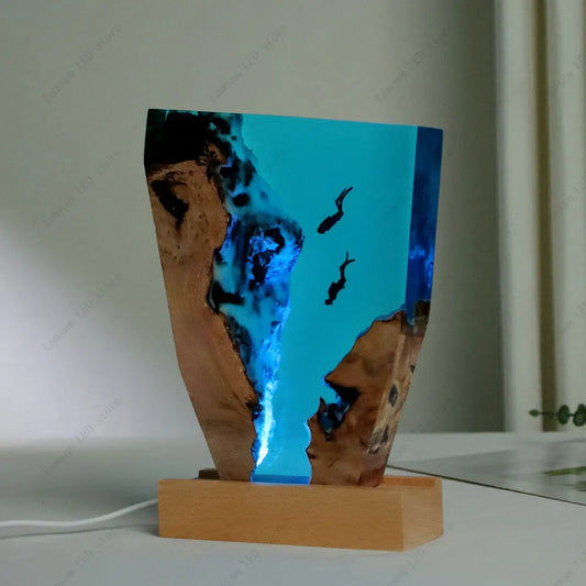 Wooden lamp with blue resin design on a white surface deep sea scuba divers lamp