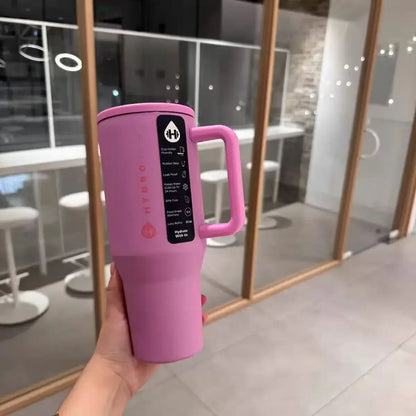 Purple HydroJug Gobelet 40OZ Voyageur Thermos with ergonomic handle and flip straw, designed for everyday hydration.