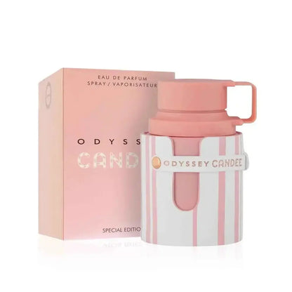 Pink and white perfume bottle with matching box labeled 'Odyssey Candee' on a white background